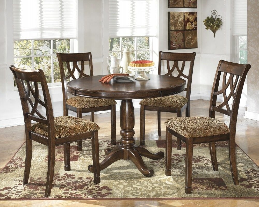 Leahlyn - 5 Pc. - Round Dining Room Table & 4 UPH Side Chairs - NC